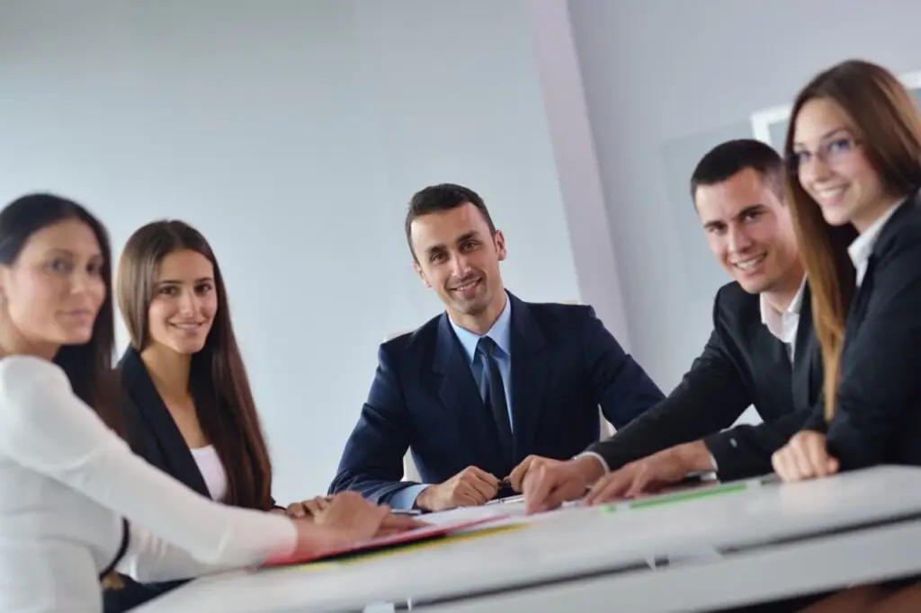 group of working professionals sitting in a chairs